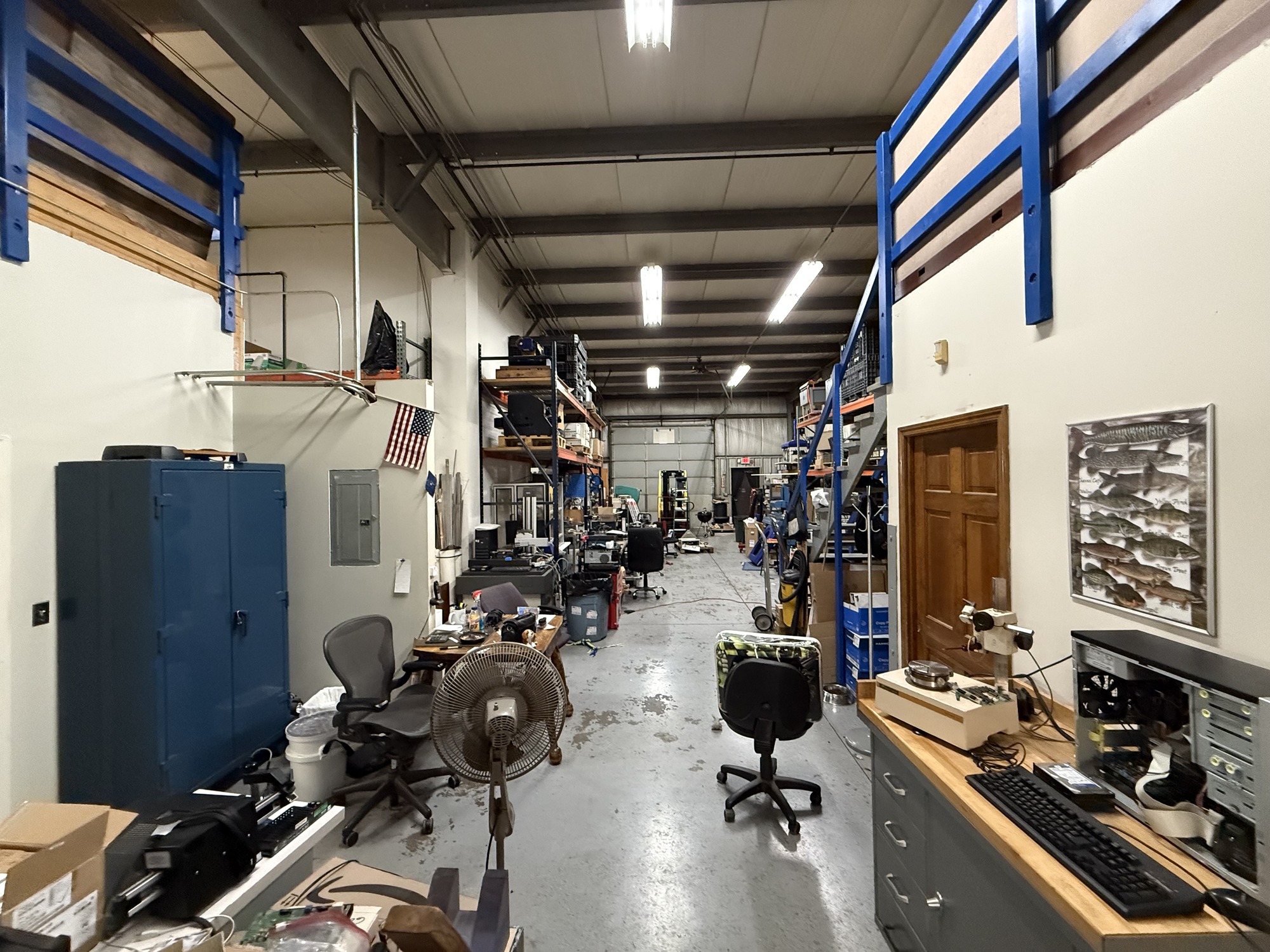 Warehouse interior with storage racks and work areas